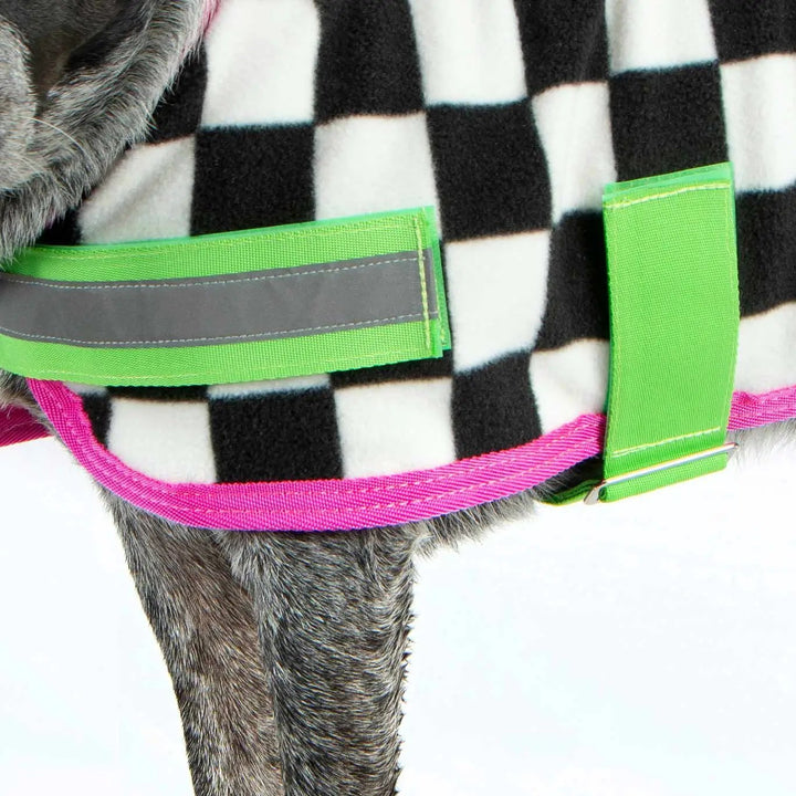 Jeffers Expression Moisture-Wicking Fleece Dog Coat with neon green straps and pink trim on black-and-white plaid.