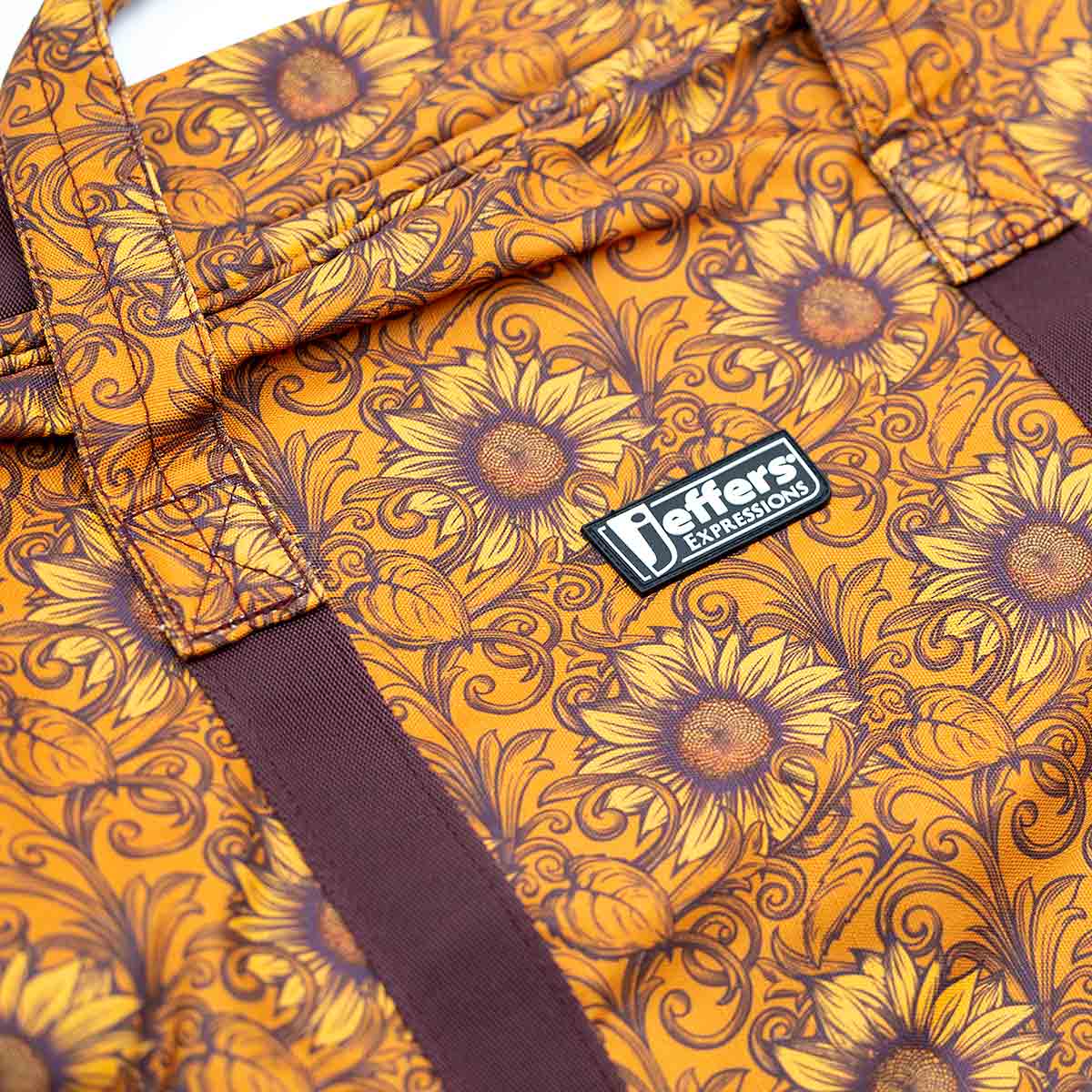 Jeffers Expressions nylon gear bag with orange sunflower print and dark brown straps