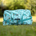 Load image into Gallery viewer, Jeffers Expression Equestrian nylon gear bag, turquoise cracked-marble pattern with teal straps and logo patch.
