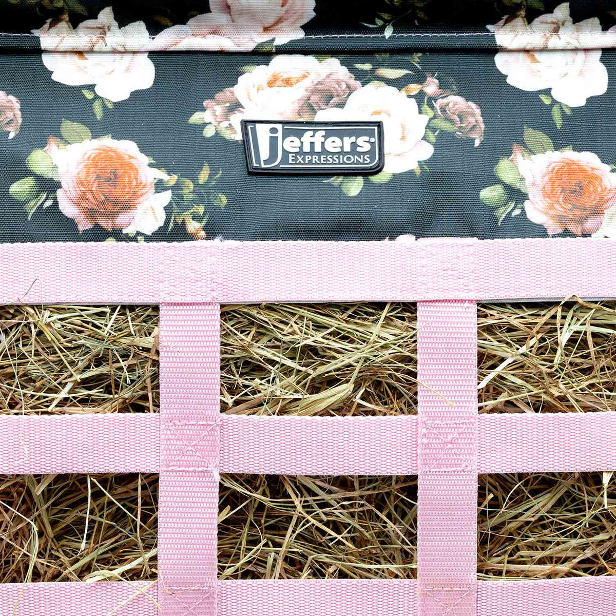 Jeffers Expression Extend-Feed Hay Bag with floral navy fabric and pink straps, hay inside