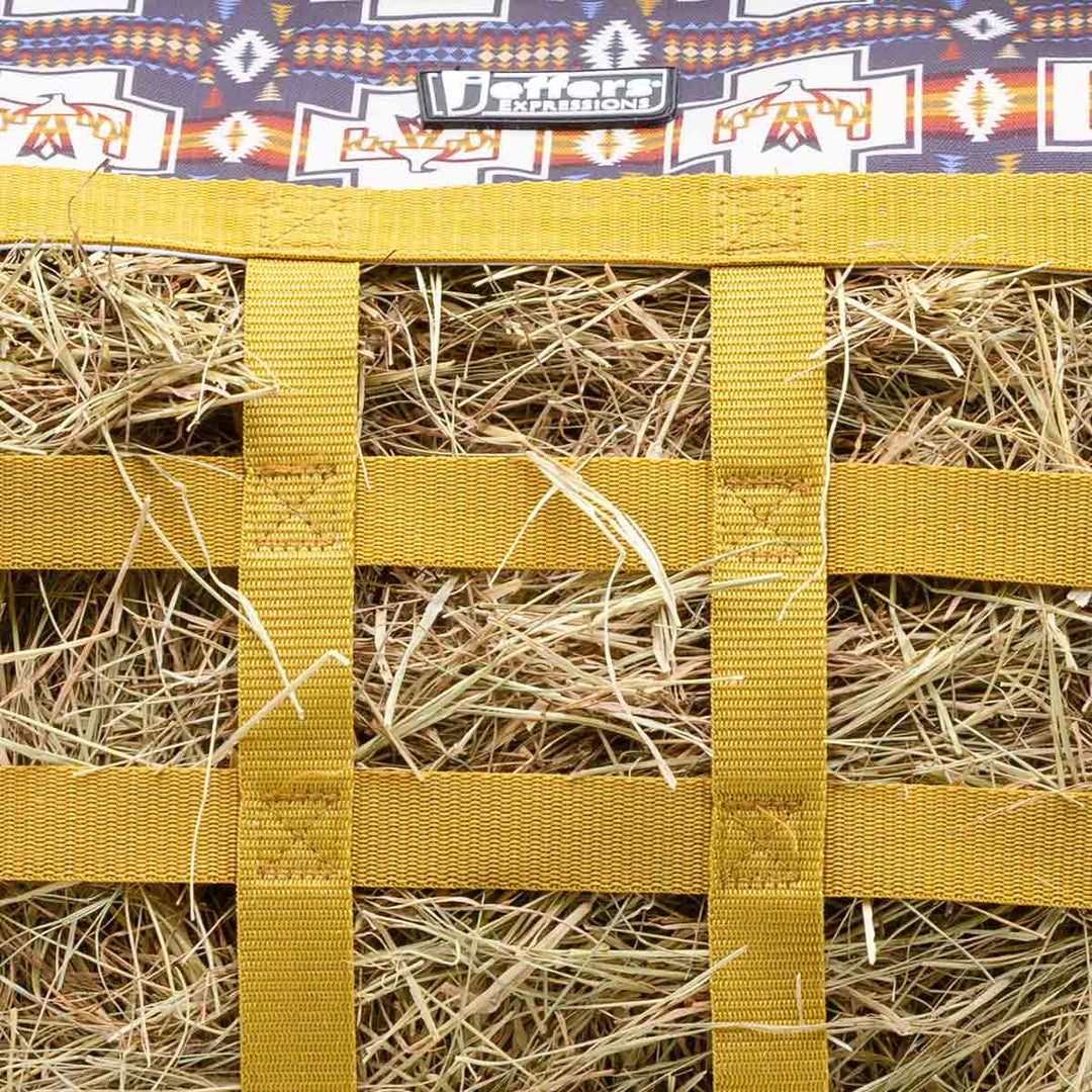 Jeffers Expression Extend-Feed Hay Bag for Horses &amp; Livestock; bright yellow nylon straps with hay visible inside.
