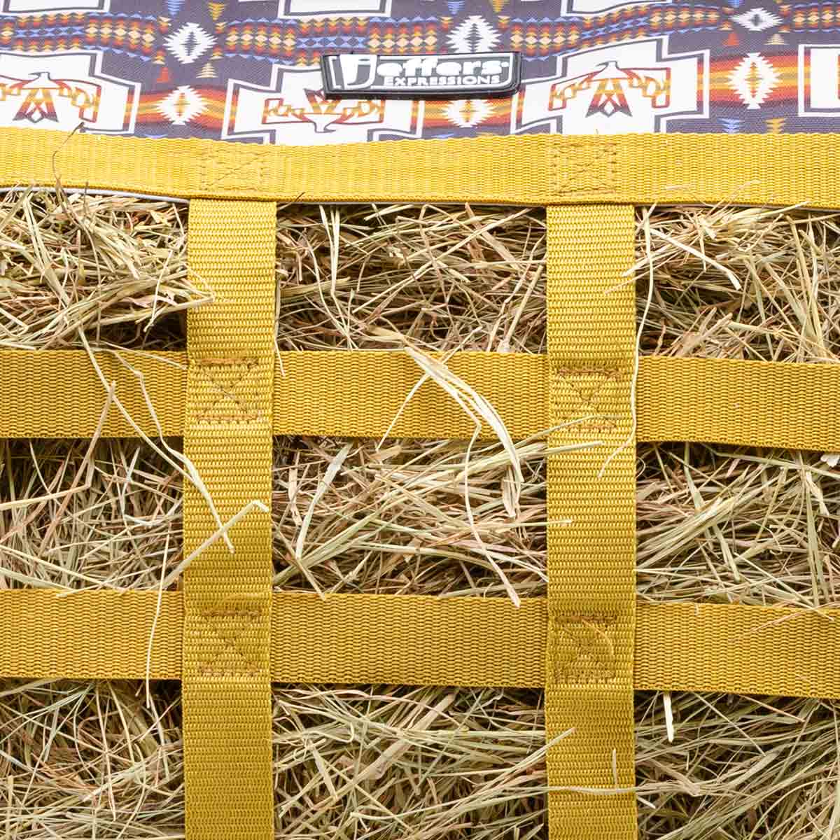 Jeffers Expression Extend-Feed Hay Bag for Horses & Livestock; bright yellow nylon straps with hay visible inside.