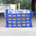 Load image into Gallery viewer, Jeffers Expressions Extend-Feed hay bag for horses and livestock, blue fabric with square strap grid and visible hay.
