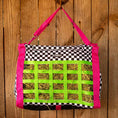 Load image into Gallery viewer, Jeffers Expression Extend-Feed hay bag for horses and livestock with pink straps and neon green grid, hay visible.
