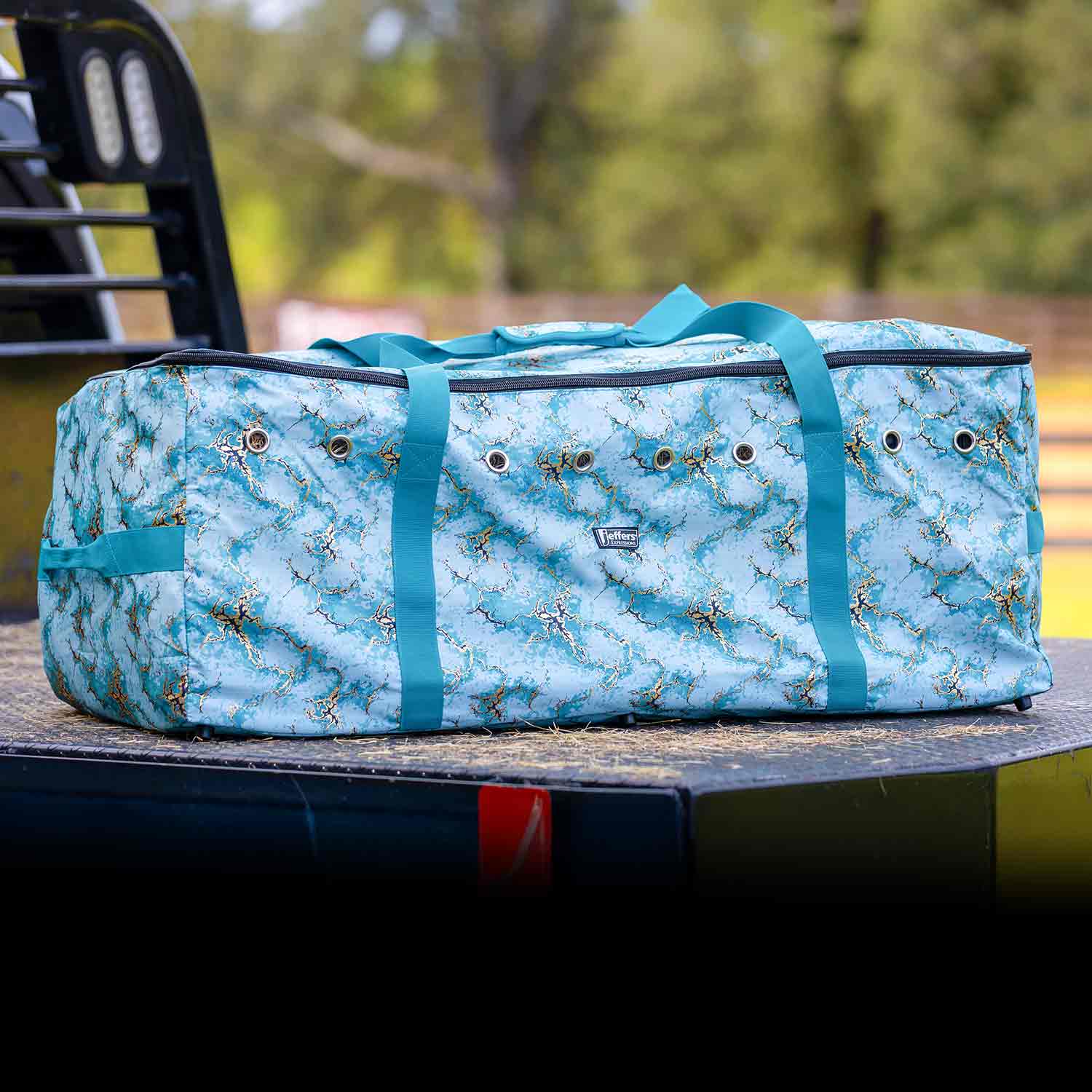 Jeffers Expression Full Hay Bale Tote Bag, blue marbled fabric with teal handles, Jeffers brand livestock feeder.