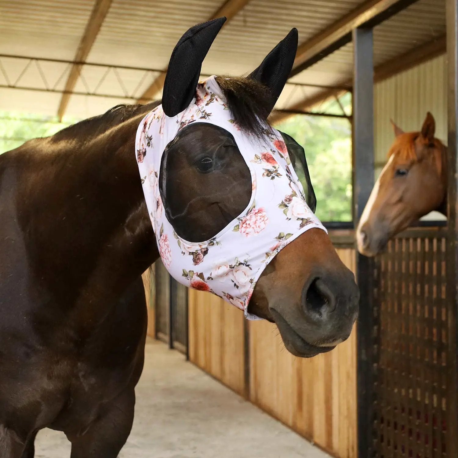 Jeffers Expression Lycra Horse Fly Mask with Ears on a dark horse; white floral mask with black ears