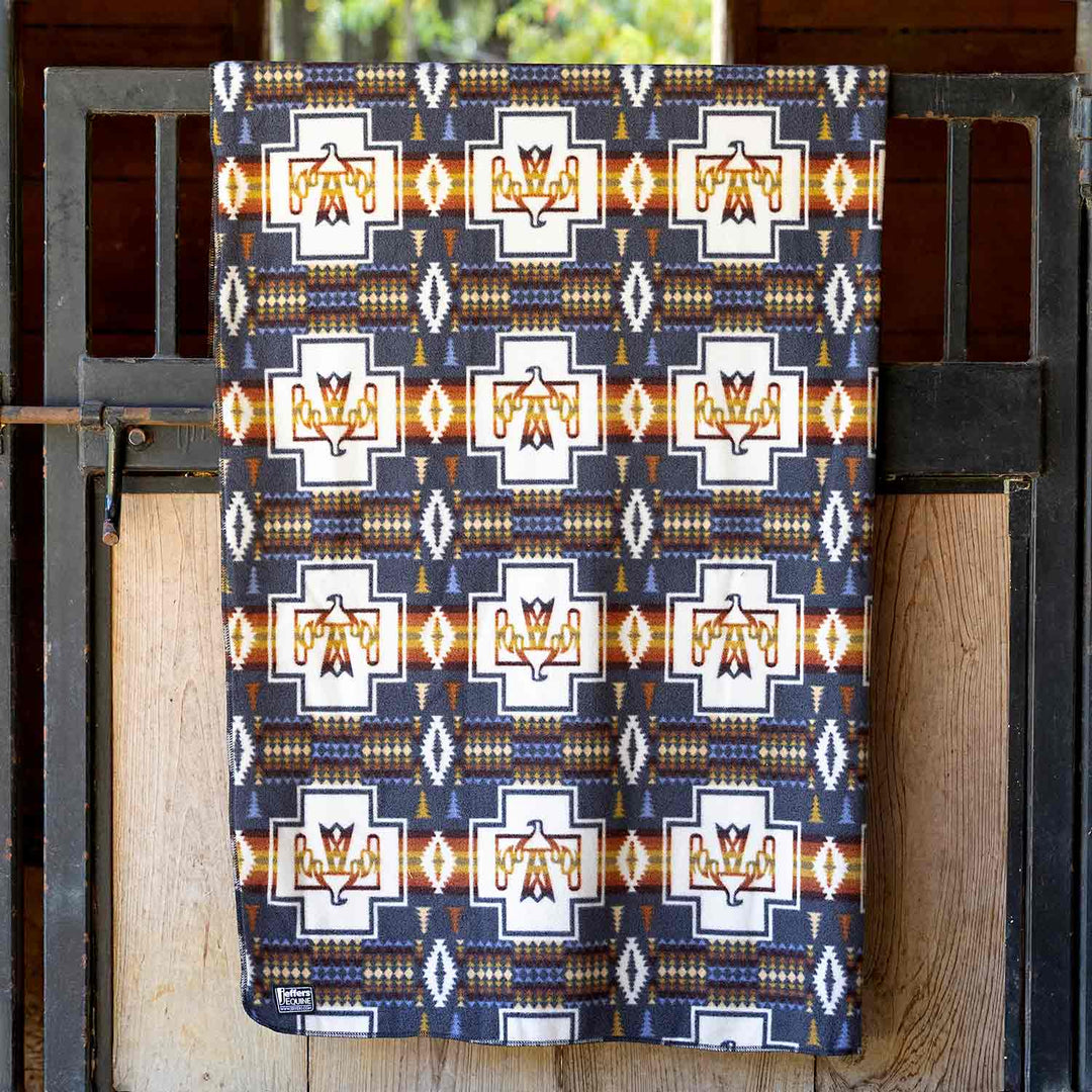 Jeffers Expression oversized fleece throw blanket in navy with white geometric crosses and orange accents
