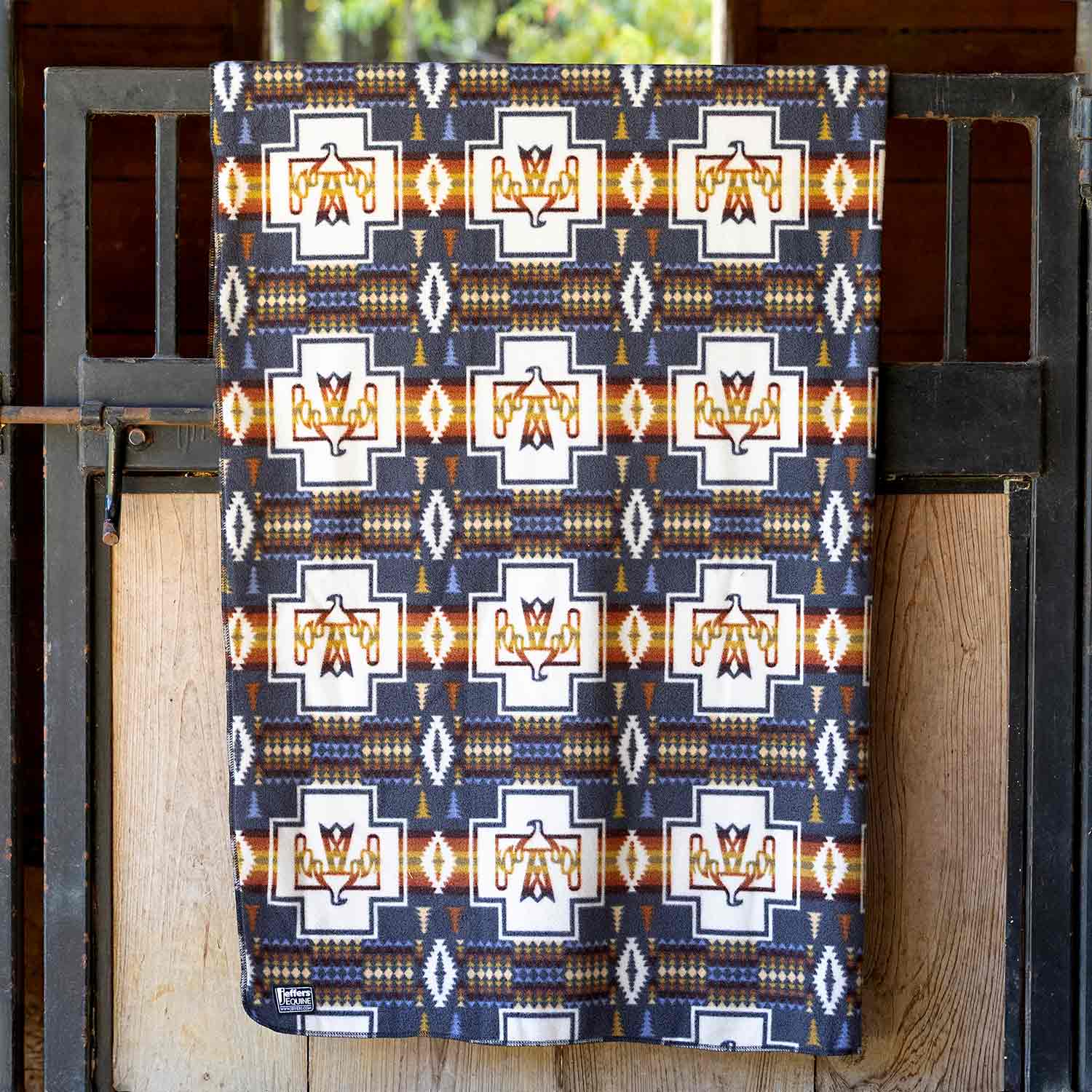 Jeffers Expression oversized fleece throw blanket in navy with white geometric crosses and orange accents