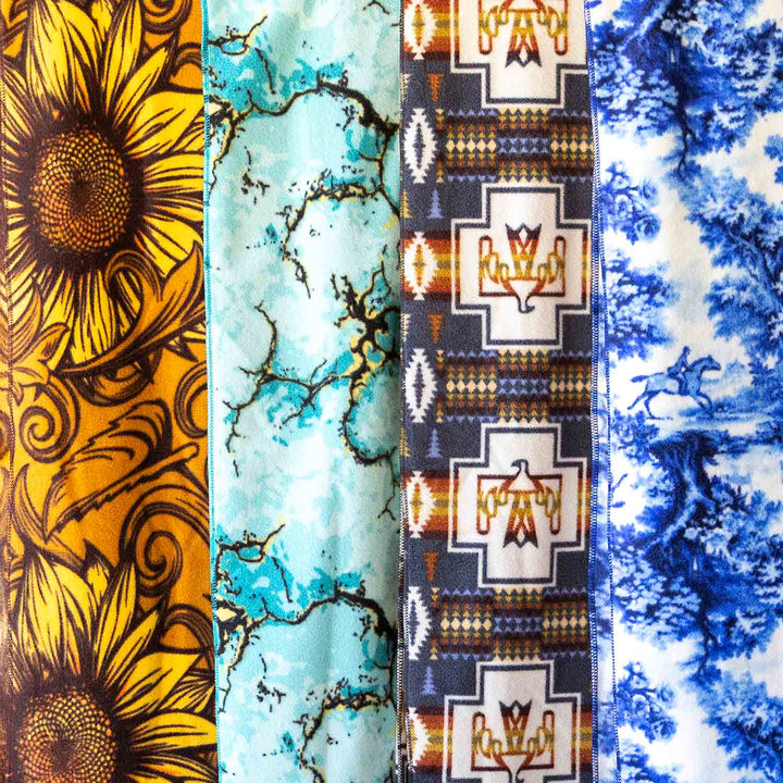 Jeffers Expression Oversized Fleece Throw Blanket; sunflower, teal marble, Southwestern cross, blue tie-dye panels.