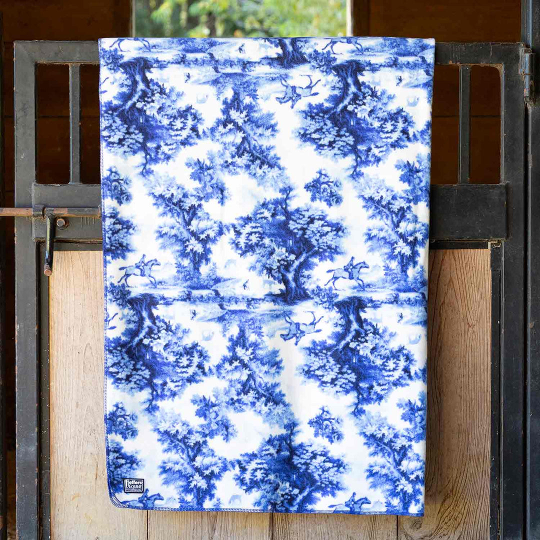Jeffers Expression oversized fleece throw blanket in blue-and-white toile pattern.