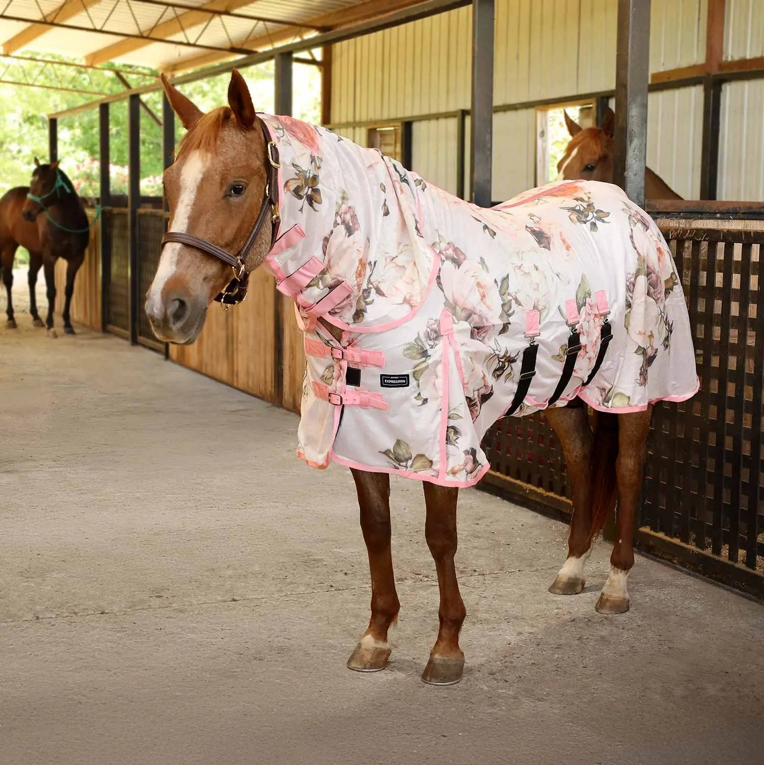 Jeffers Expression softmesh combo neck horse fly sheet in pink floral pattern on a chestnut horse in a stable