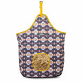 Load image into Gallery viewer, Jeffers Expression Top Loading Hay Bag, 600 Denier, blue geometric pattern with yellow trim and hay-filled opening
