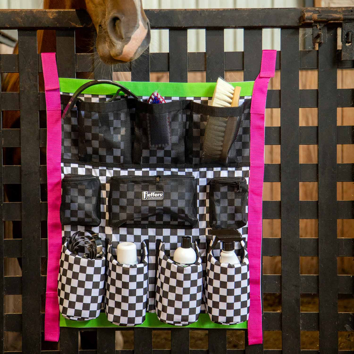 Jeffers Expression Trailer Door Horse Grooming Caddy; black-and-white checkered pockets with bright pink straps.