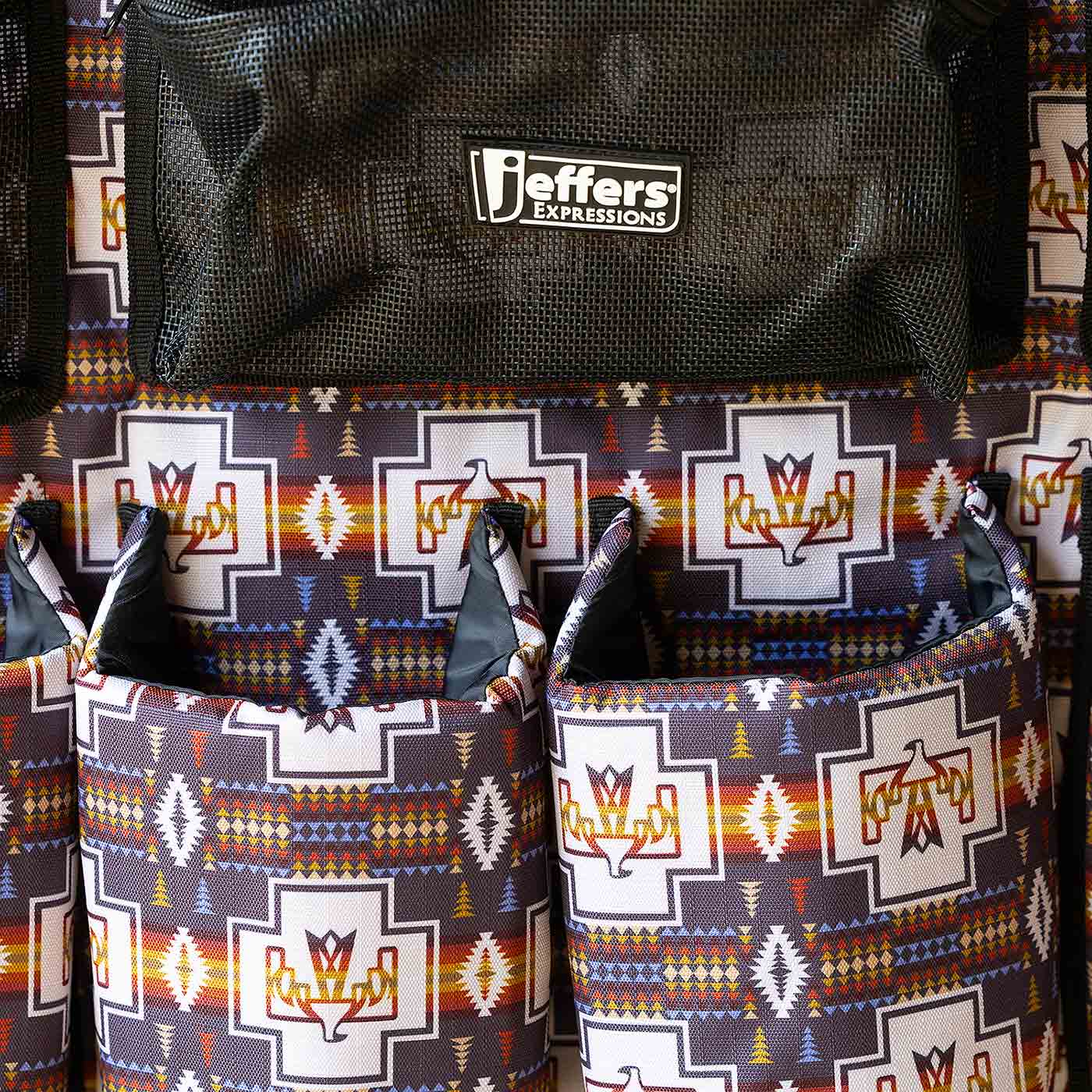 Jeffers Expressions trailer-door horse grooming caddy with black mesh pocket on colorful geometric print fabric