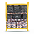 Load image into Gallery viewer, Jeffers Expressions Trailer Door Grooming Caddy with yellow frame and patterned fabric pockets; six lower pockets
