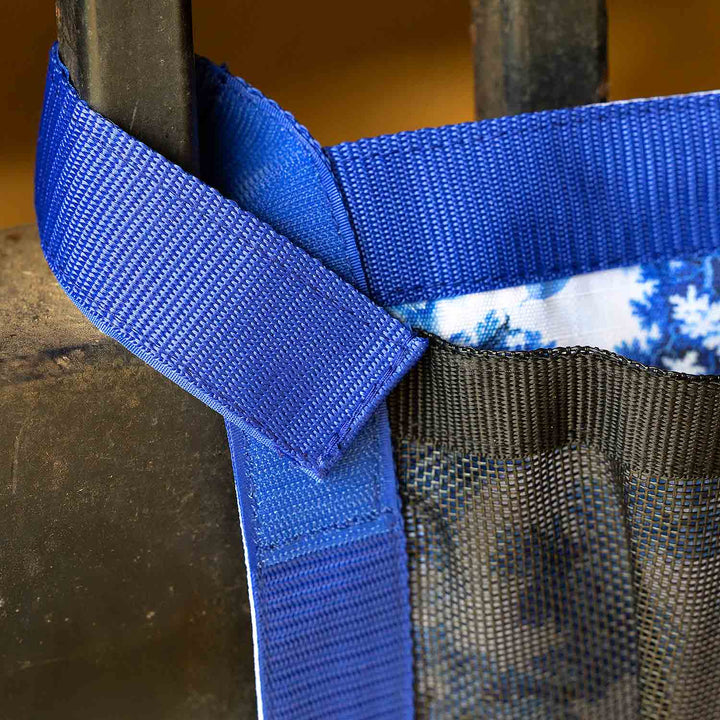 Jeffers Expression Trailer Door Horse Grooming Caddy in blue nylon webbing with a black mesh pocket.