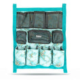 Load image into Gallery viewer, Jeffers Expression Trailer Door Horse Grooming Caddy, teal hanging organizer with multiple mesh pockets and pouches.
