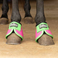 Bild in Galerie-Betrachter laden, Bell boots for horses in neon green and pink by Jeffers Expressions on two front hooves
