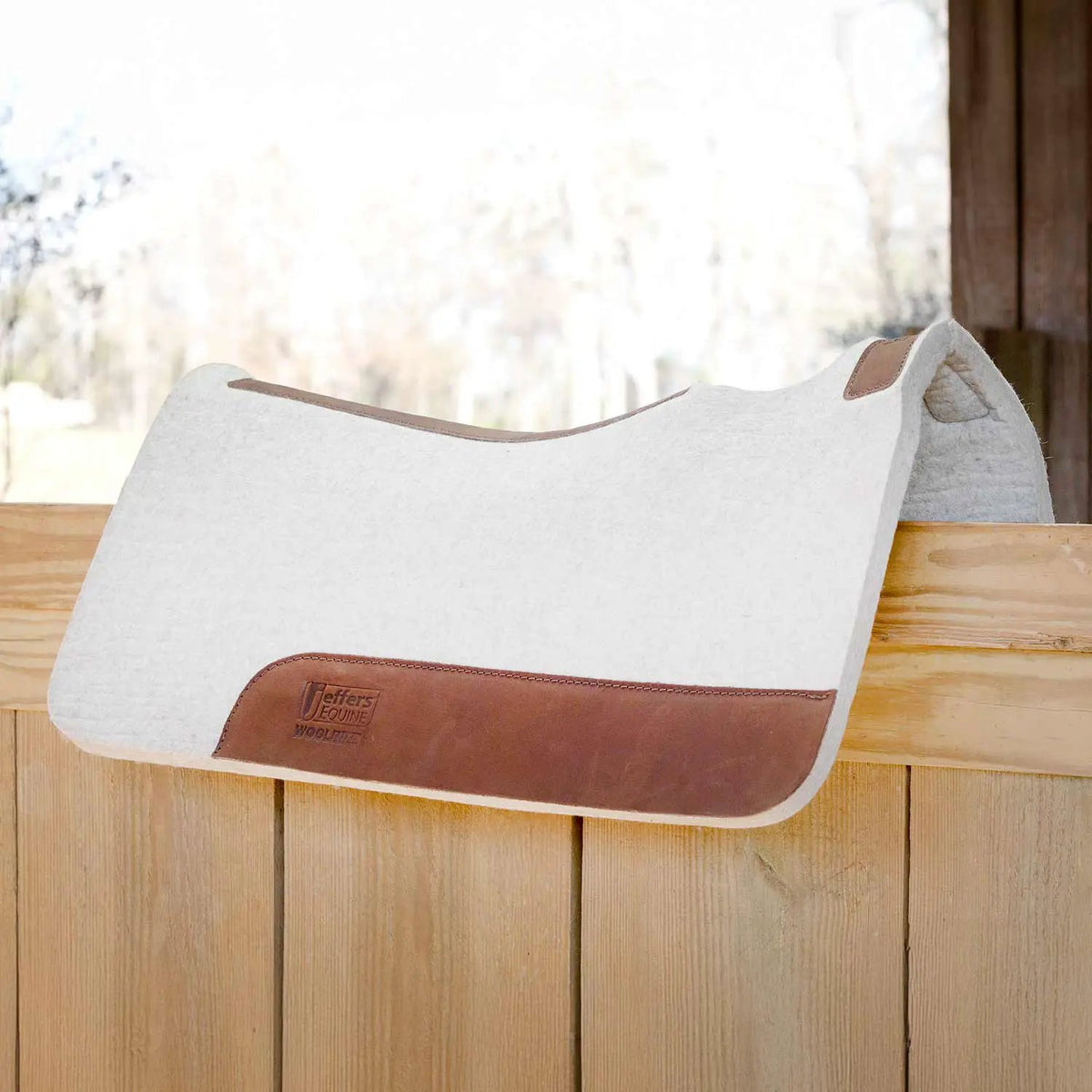 Jeffers WoolLuxe 100% Wool equine saddle pad, white wool with brown leather trim and Jeffers patch
