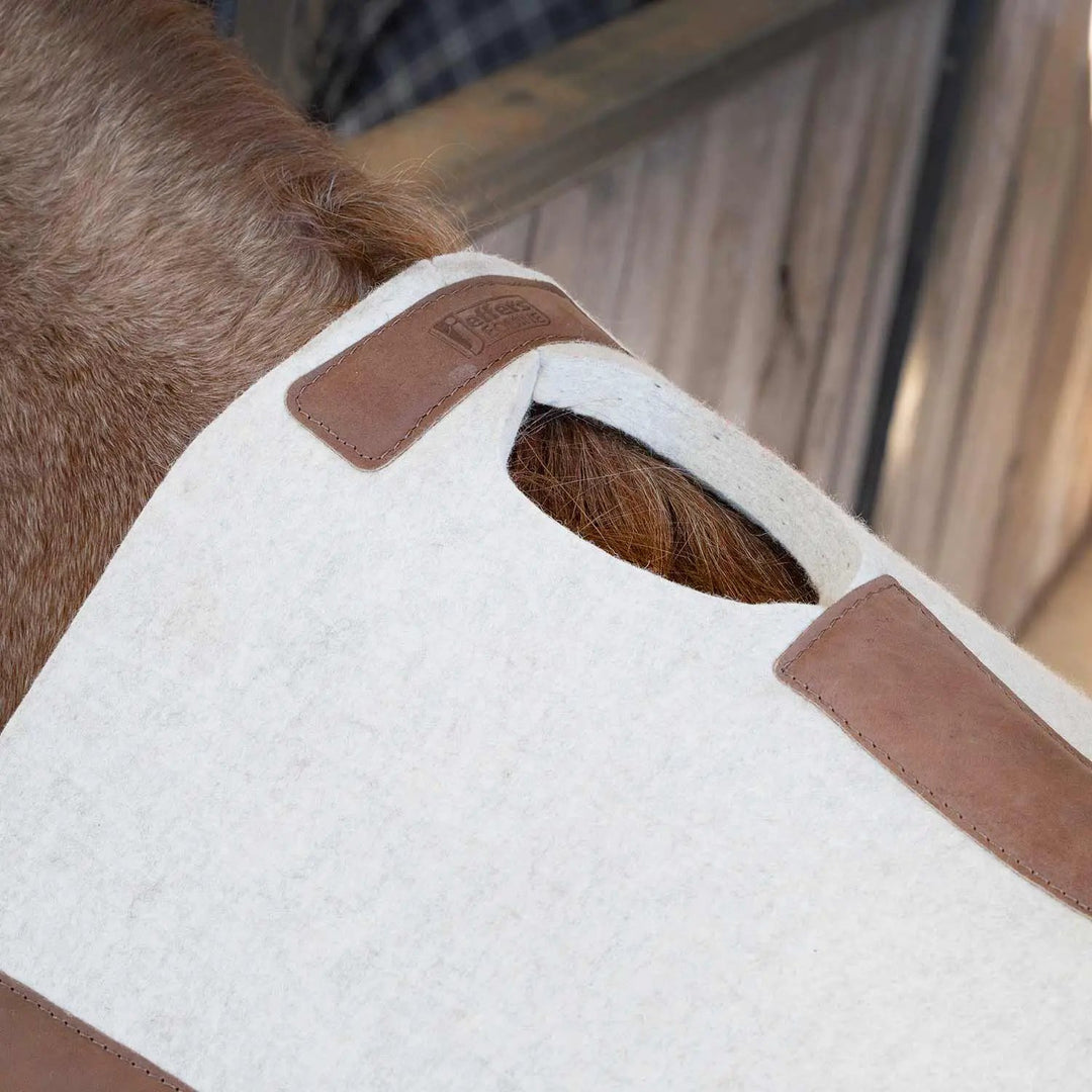 Jeffers WoolLuxe saddle pad, 100% wool, white with brown leather corner patches.