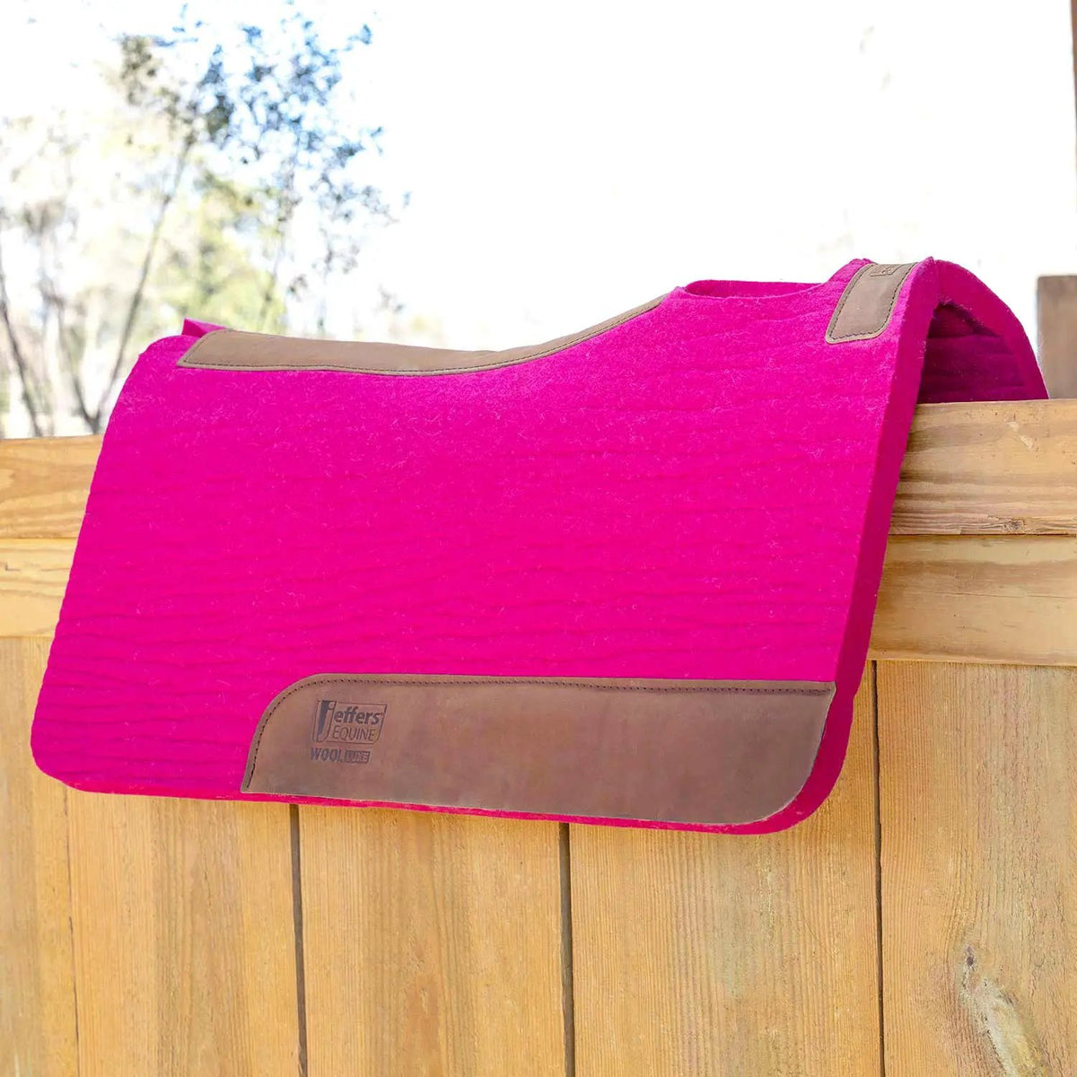 Jeffers WoolLuxe saddle pad, 100% wool, bright pink with tan leather trim.