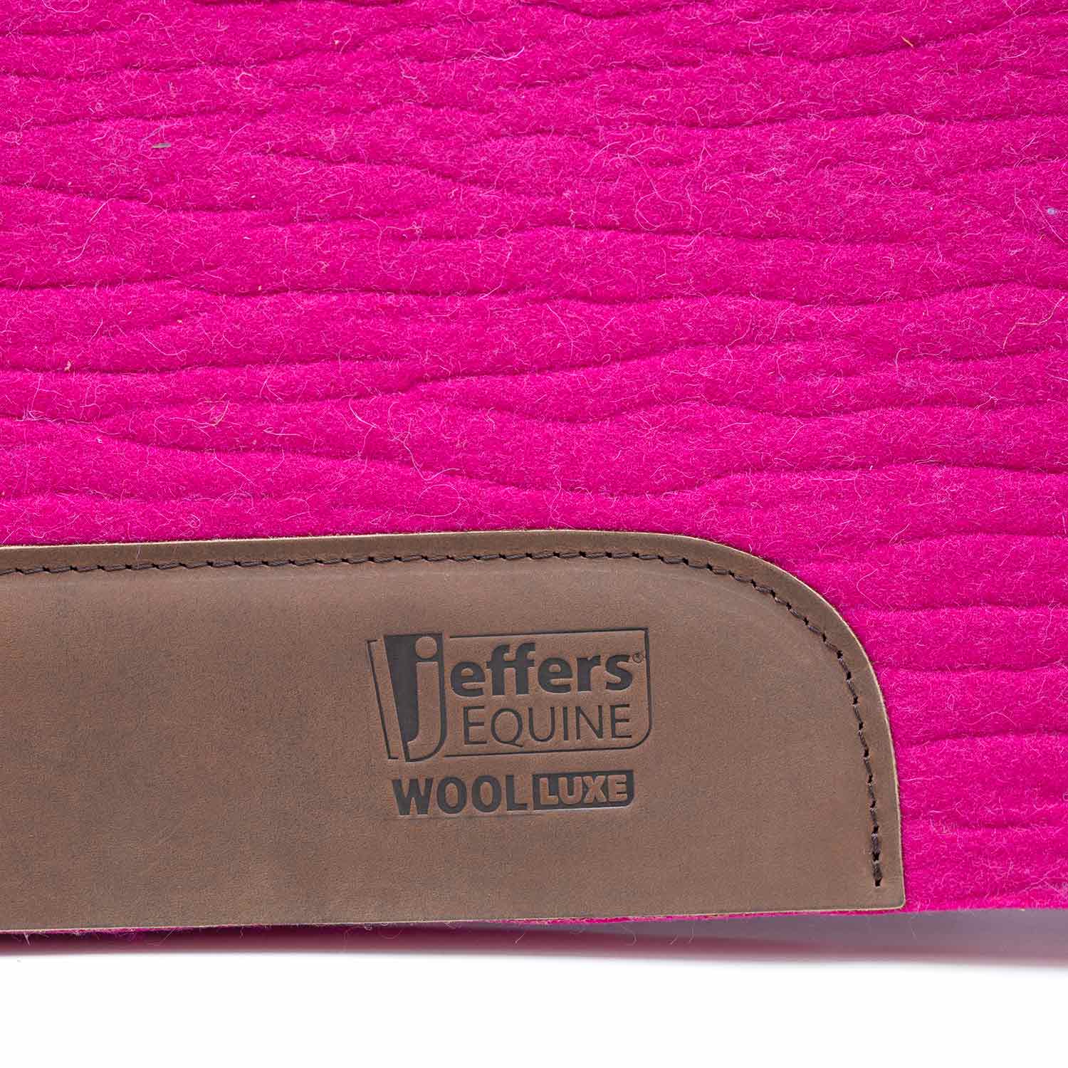 Jeffers Equine WoolLuxe saddle pad in bright pink with brown leather patch