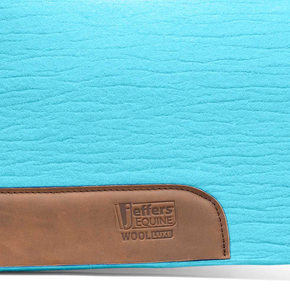 Jeffers WoolLuxe saddle pad, blue quilted top with brown leather patch logo