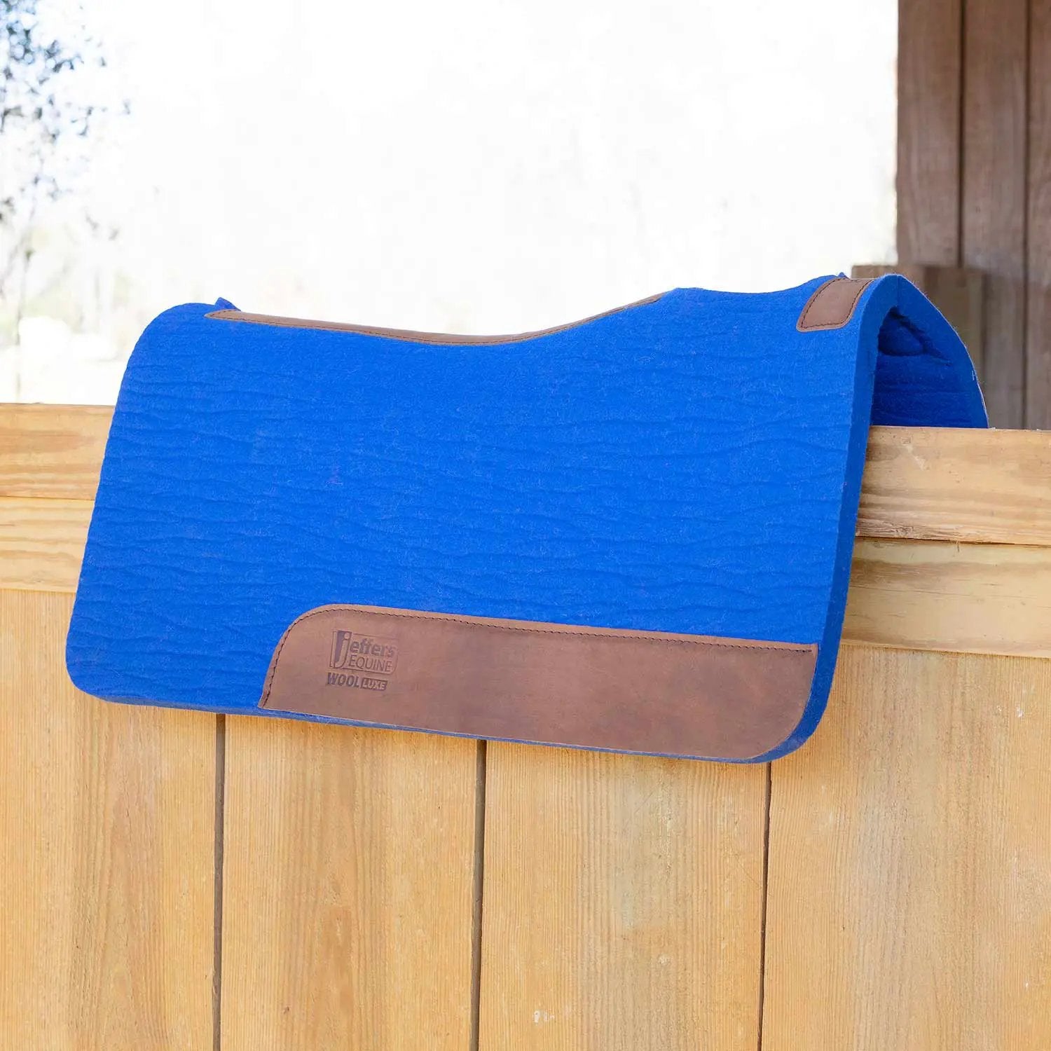 Jeffers WoolLuxe saddle pad, blue 100% wool with brown leather accents, cushioned and breathable