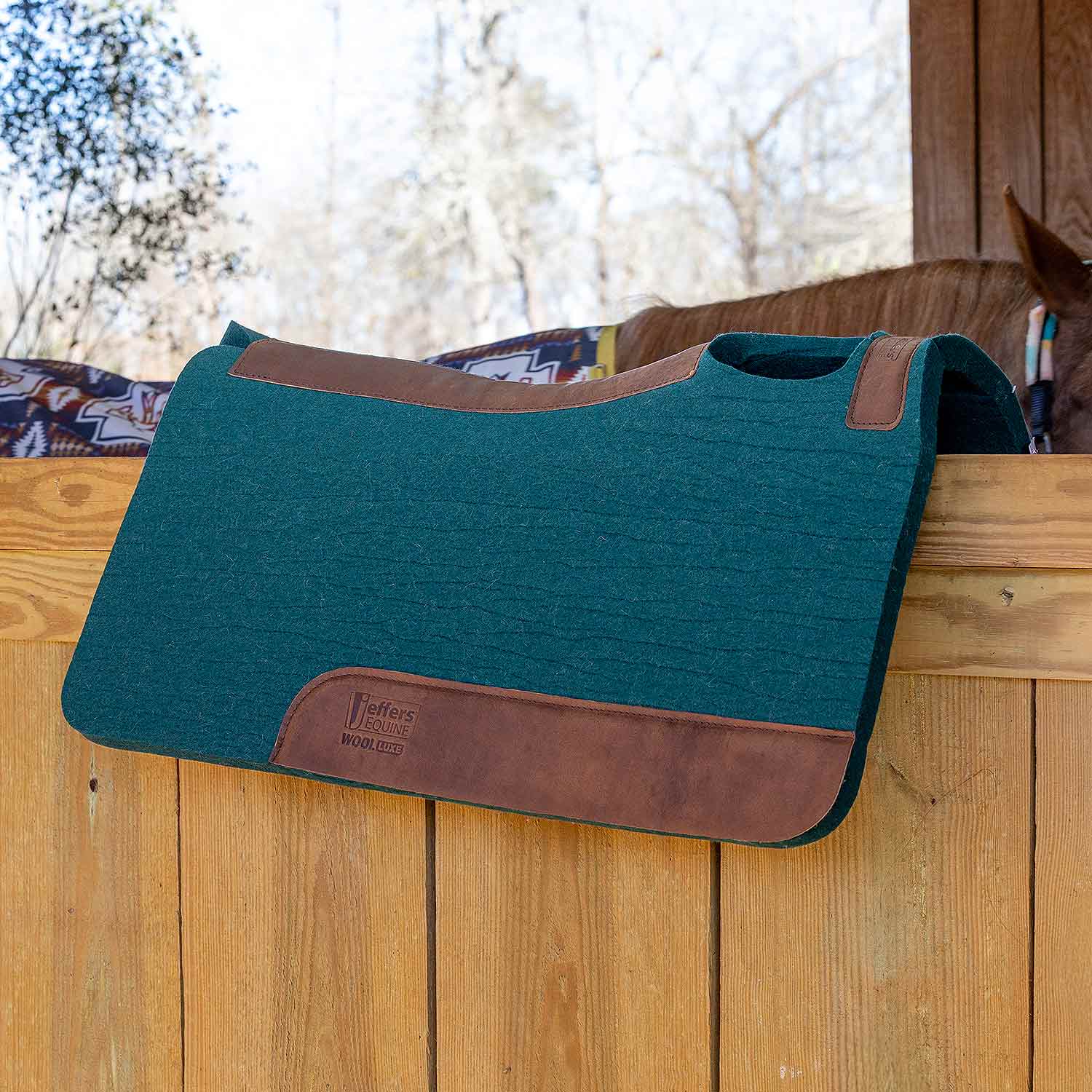 Jeffers WoolLuxe saddle pad, teal wool with brown leather trim and Velcro tabs