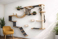 Gallery viewerに画像を読み込む, The Juggernaut indoor cat condo wall playground in natural wood with black ramps; two cats exploring.
