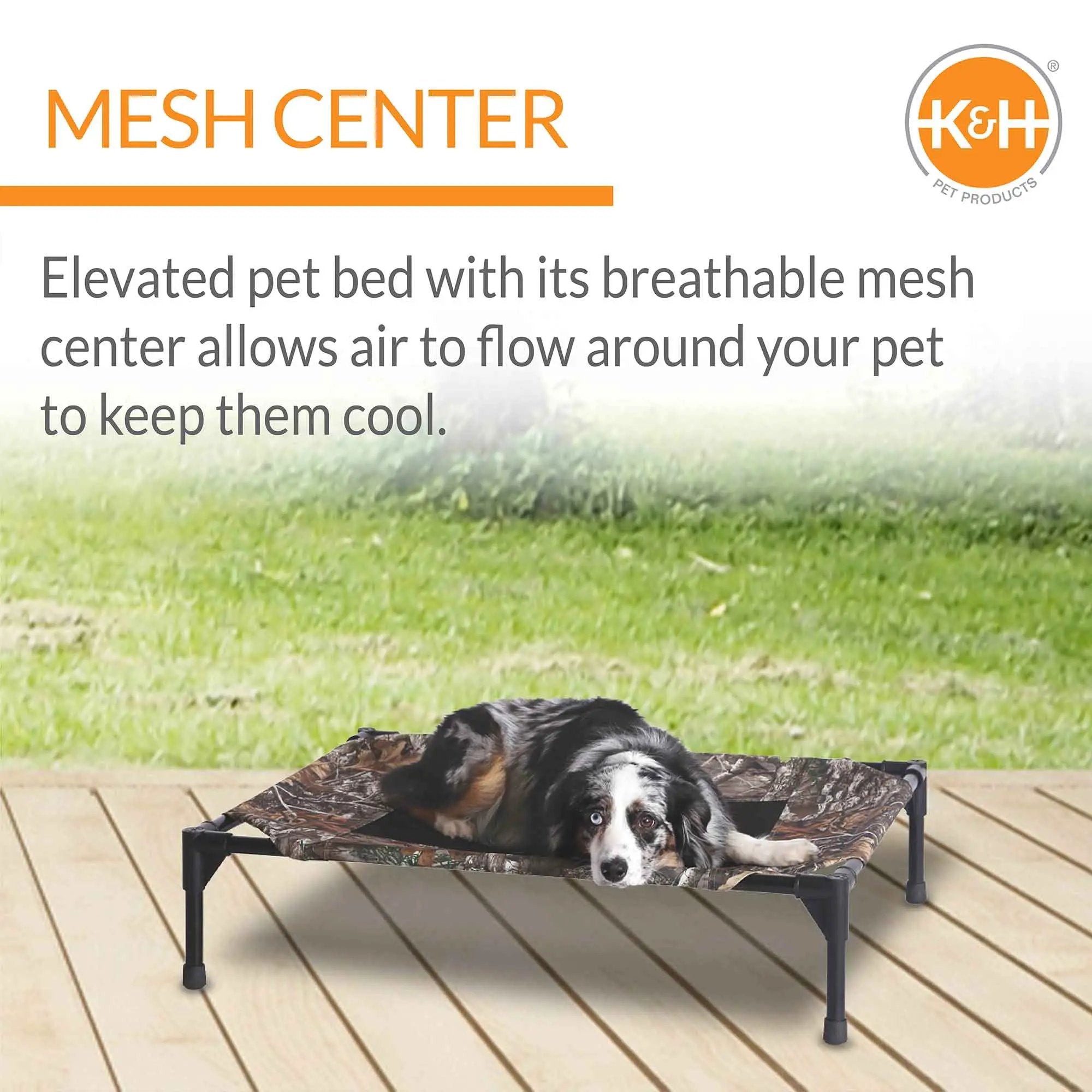K&H Original Pet Cot Elevated Dog Bed with Realtree Edge camo fabric on a black frame, dog resting.