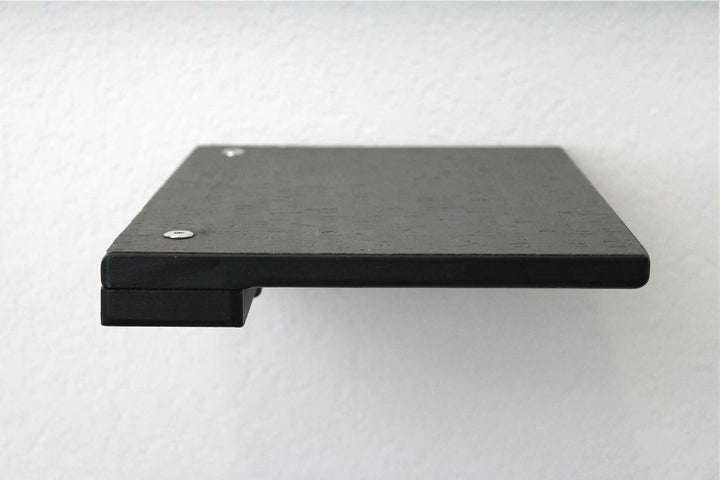 Cat climbing shelf platform in black wood with visible screws on top