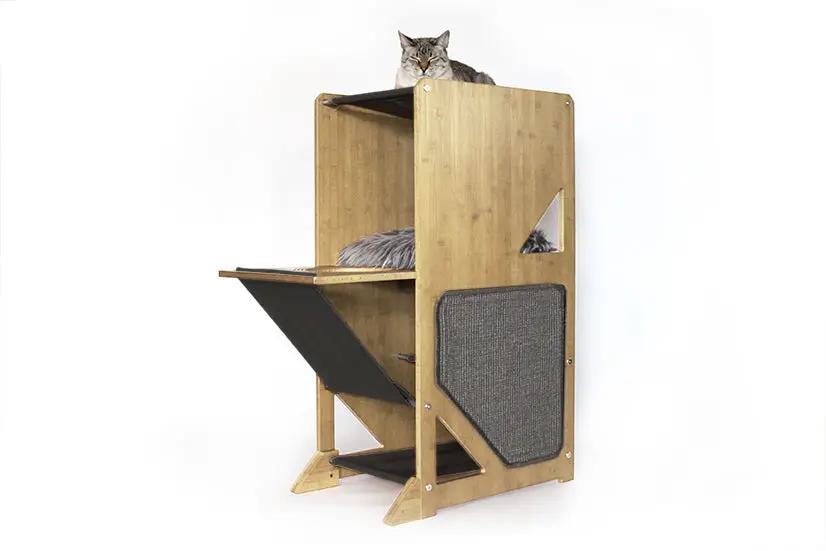 The Overlook bamboo cat condo by Catastrophic Creations; multi-level cat tree with fabric panels and a cat on top