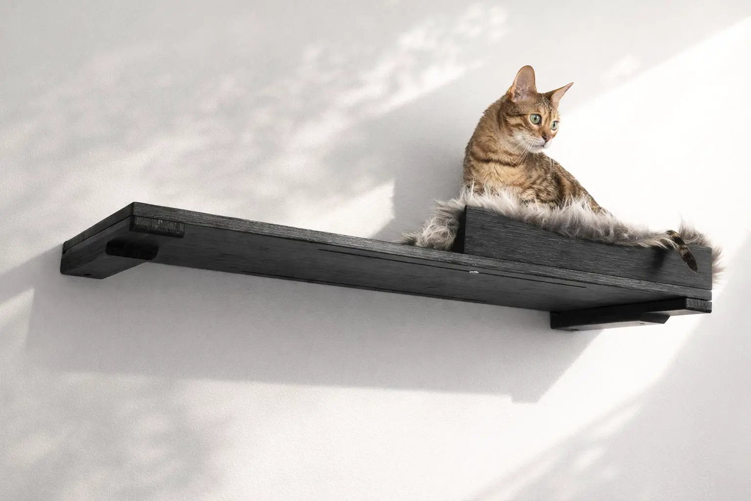 Cat Nest Bed on a dark wooden cat shelf with fluffy faux-fur lining; cat lounging.