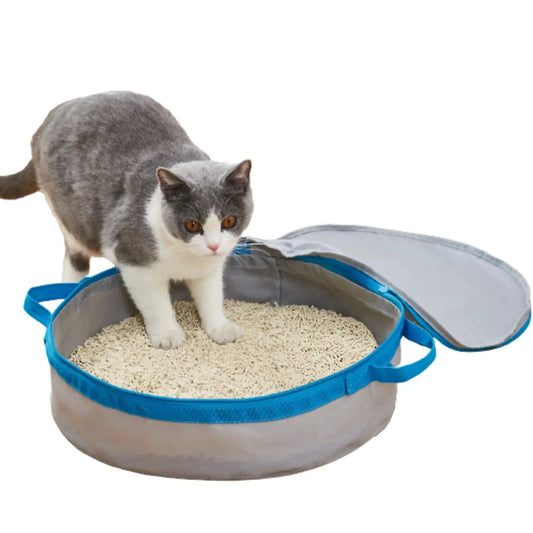 Mr. Peanut's PortaPotty travel cat litter box; blue handles, gray tote, cat stepping into litter.