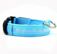 Bild in Galerie-Betrachter laden, Blue LumaGlow adjustable LED dog collar with a pale center strip, black buckle, and metal D-ring.
