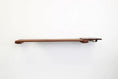 Carica l'immagine nel visualizzatore della galleria, Wall-mounted brown wooden cat feeding shelf with a metal bowl on the right, cat furniture accessory
