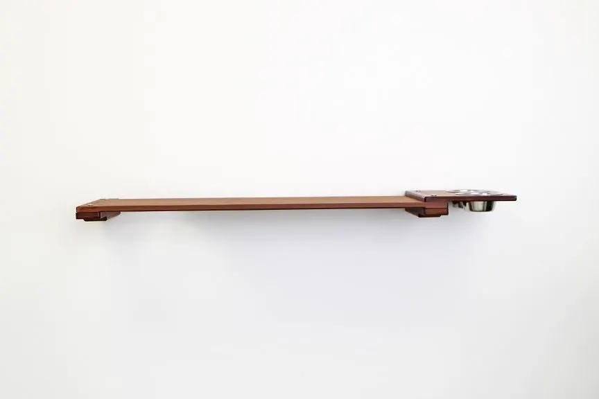 Wall-mounted brown wooden cat feeding shelf with a metal bowl on the right, cat furniture accessory