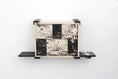 Carica l'immagine nel visualizzatore della galleria, Deluxe Cat Cubby Bed by Catastrophic Creations; beige/black cat condo mounted on wall with shelf and two bowls
