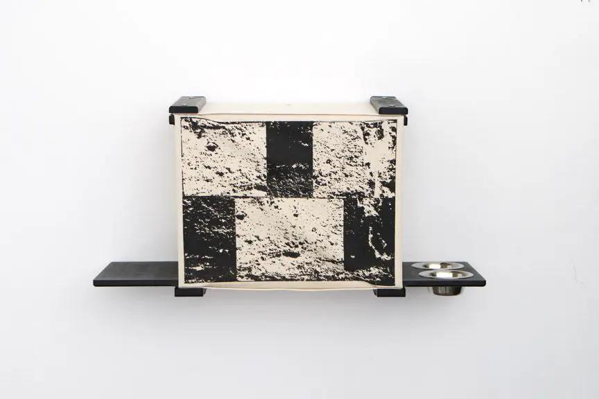 Deluxe Cat Cubby Bed by Catastrophic Creations; beige/black cat condo mounted on wall with shelf and two bowls