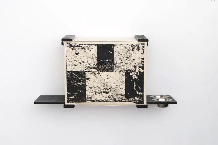 Deluxe Cat Cubby Bed by Catastrophic Creations; beige/black cat condo mounted on wall with shelf and two bowls