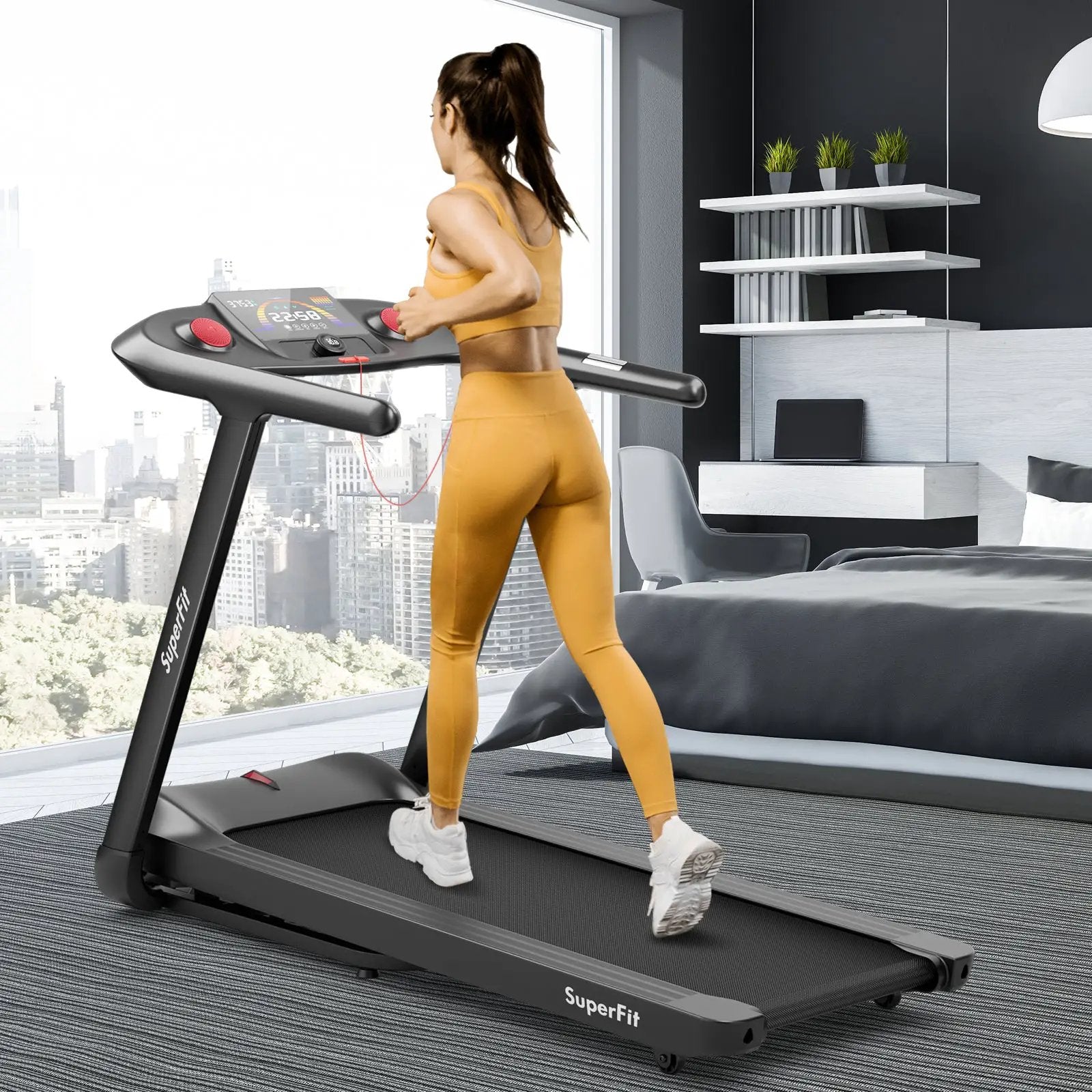 Black treadmill with red buttons; woman in mustard activewear running in a modern room with city view; SuperFit