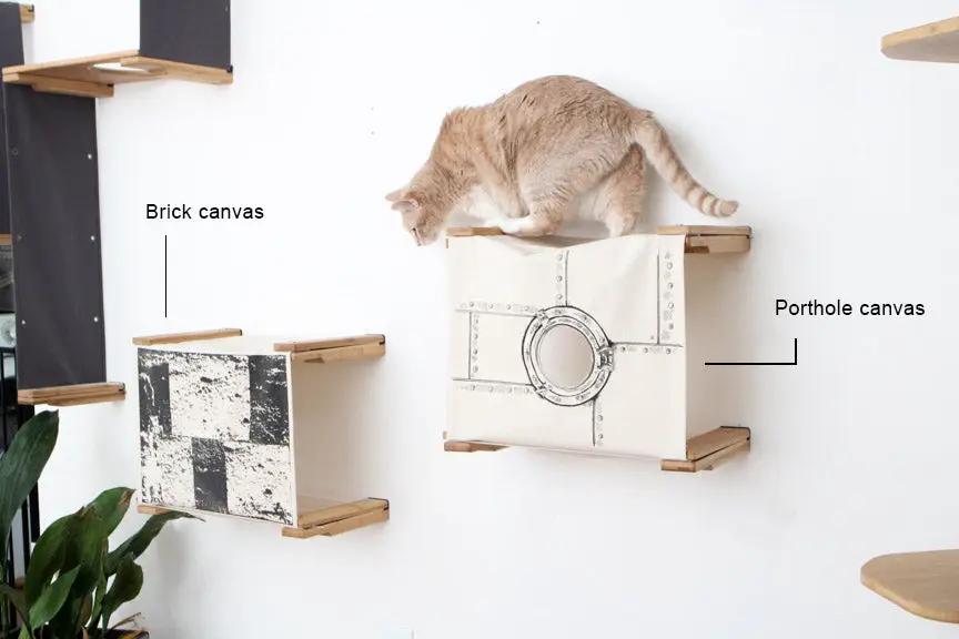 Enclosed Cat Bed - Cat Wall Cubby by Catastrophic Creations; two wall-mounted cubbies with brick and porthole canvases