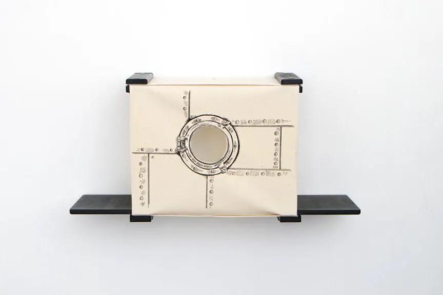 Cat Cubby for Wall - Covered Cat Bed, beige canvas with circular porthole, wall-mounted with black shelves.