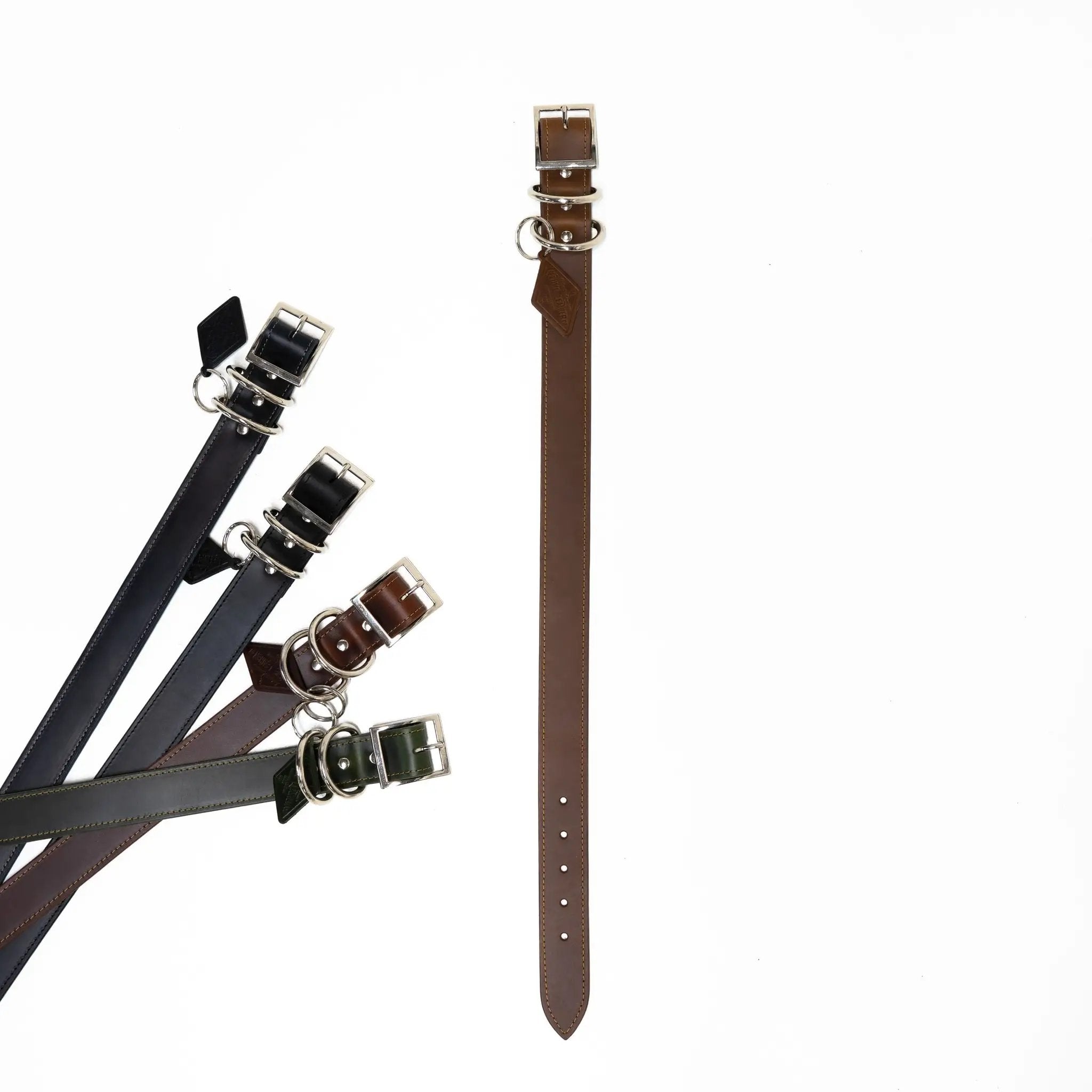 Leather dog collars by For Animals, With Love; black, brown, and green leather with metal buckles