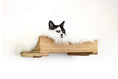 Load image into Gallery viewer, The Cat Nest Bed wooden cat perch by Catastrophic Creations featuring wood tones and fluffy white faux fur lining.
