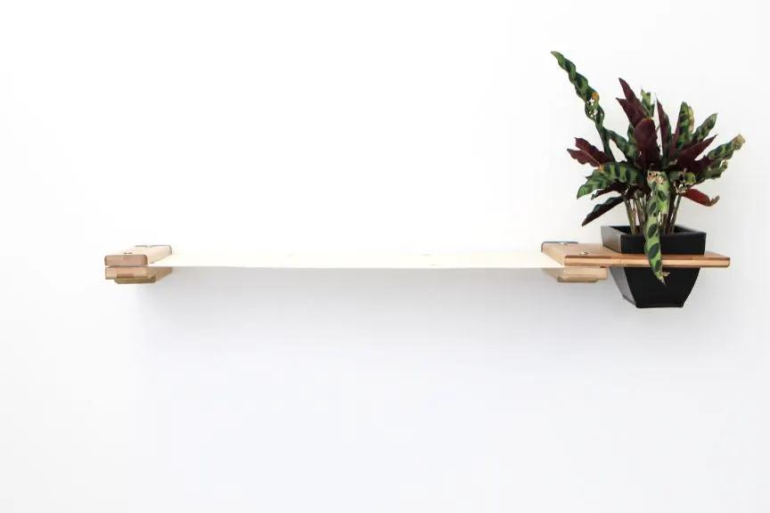 Cat Hammock Wall with Planter by Catastrophic Creations; white beam with natural wood ends and black planter.