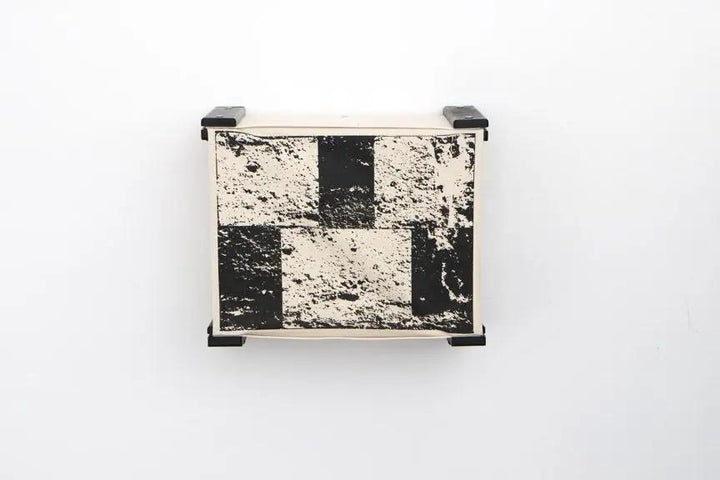 Enclosed cat bed wall cubby by Catastrophic Creations; wood frame with black-and-white checker pattern